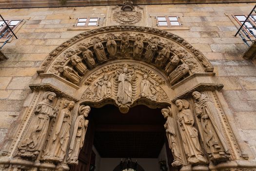 Carved romanesque door entrance to the san Xerome building in Santiago de Compostela, Spain