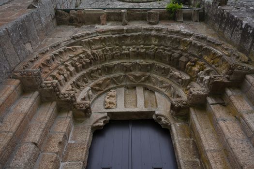 Lateral door with its archivolts and voussoir in the romanesque monatery of Carboeiro in the province of Pontevedra Spain