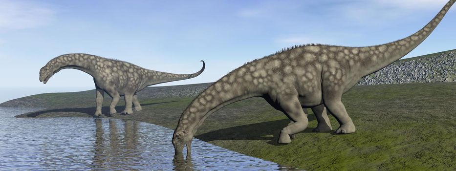 Two argentinosaurus dinosaurs drinking next to water in green landscape by day