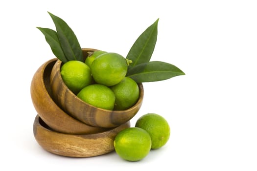 Wooden bowl filled with limes