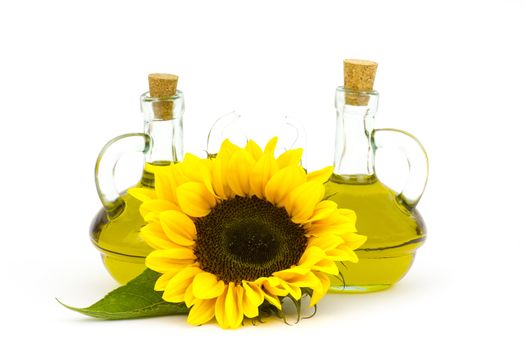 sunflower oil and sunflowers isolated on white background