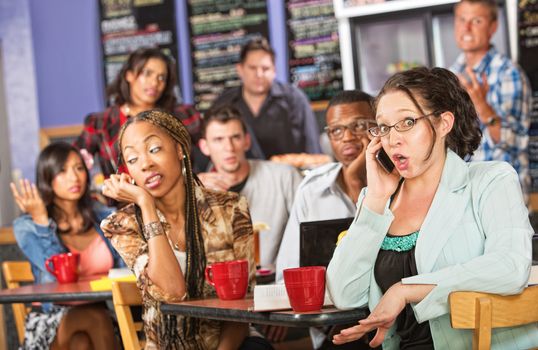 Talkative female on cell phone annoying students in cafe
