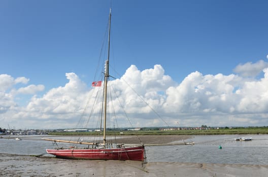 Red boat at low Tide