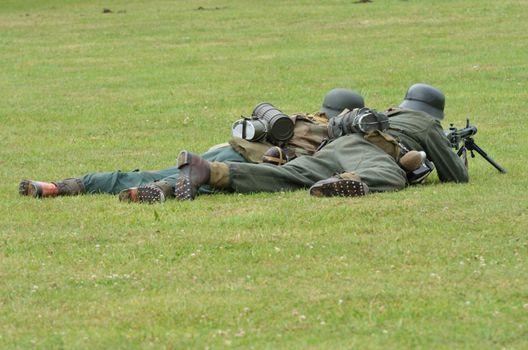 German soldiers on ground with machine gun