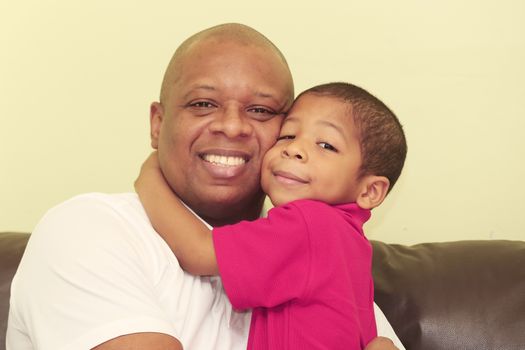 Portrait of african father and his son. Focus in the kid.