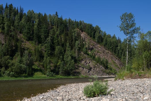 The mountain river with rapid current