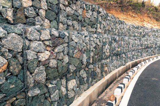 Wall rock landslides, protective gabion wall in mountains