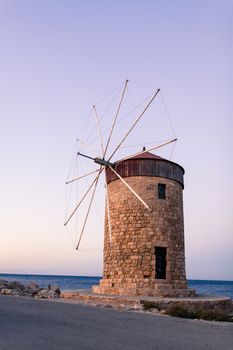 Windmill In Mandraki Port in Rhode Island in Greece.