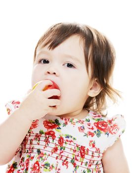 Closeup portrait of little girl eating apple