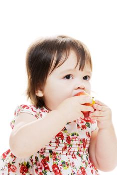 Infant girl tasting delicious apple for first time portrait