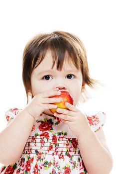 Little girl biting red apple closeup portrait