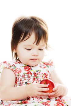 Little girl holding a red apple closeup portrait