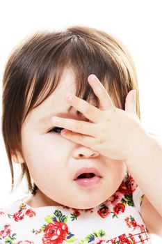 Little girl with hand on face closeup portrait