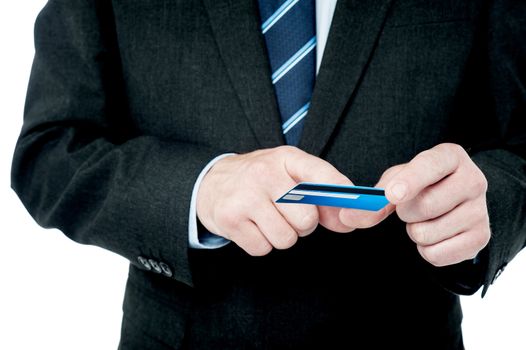 Cropped image of businessman checking his credit card