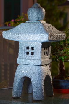 Small stone eastern temple with candles inside