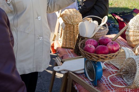 rural garden red apples in wicker basket on blue food scales