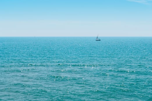 Yacht and blue water ocean