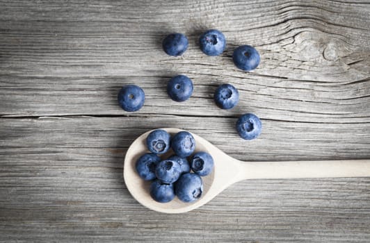 Blueberries on a wooden spoon