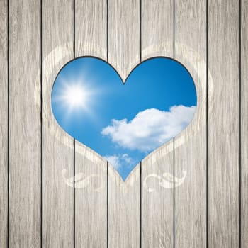 An image of a beautiful wooden heart with the blue sky