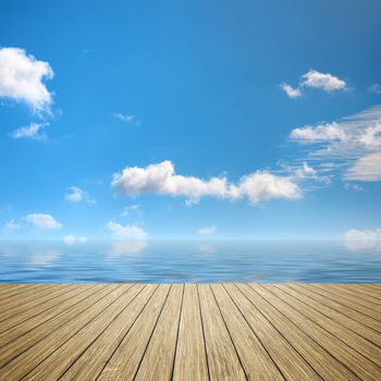 An image of a wooden jetty blue sky background