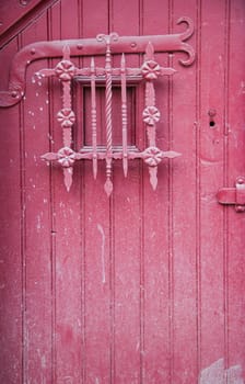 old red door in small old town