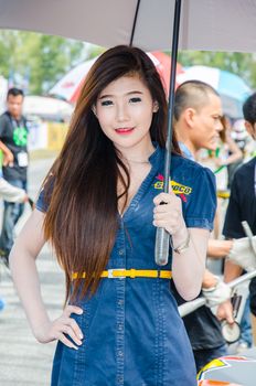 CHON BURI - JULY 5: Unidentified model with racing car on display at the Thailand Super Series 2014 Race 3 on July 5, 2014 at the Bira International Circuit Pattaya, Chon Buri Thailand.