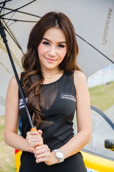CHON BURI - JULY 5: Unidentified model with racing car on display at the Thailand Super Series 2014 Race 3 on July 5, 2014 at the Bira International Circuit Pattaya, Chon Buri Thailand.