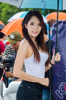 CHON BURI - JULY 5: Unidentified model with racing car on display at the Thailand Super Series 2014 Race 3 on July 5, 2014 at the Bira International Circuit Pattaya, Chon Buri Thailand.