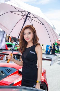 CHON BURI - JULY 5: Unidentified model with racing car on display at the Thailand Super Series 2014 Race 3 on July 5, 2014 at the Bira International Circuit Pattaya, Chon Buri Thailand.