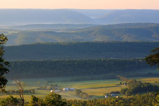 Foggy sunrise on valleys and mountains in Juniata County, Pennsylvania.