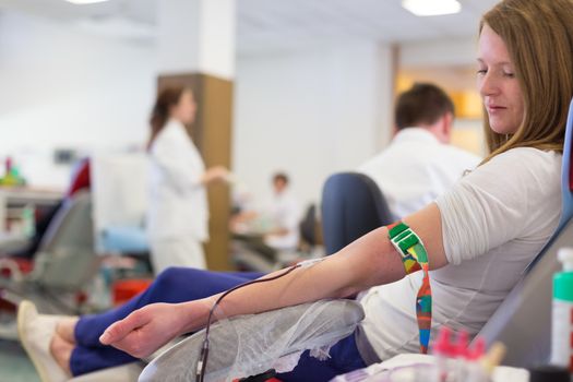 Role of nurses in blood services and donor sessions.  Nurse and blood donor at donation.