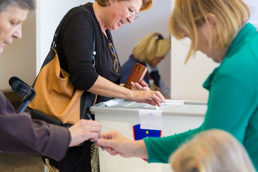 LJUBLJANA, SLOVENIA - JULY 13: People voting on parliamentary election for the 90 deputies to the National Assembly of Slovenia on June 13th, 2014, Ljubljana, Slovenia, EU.