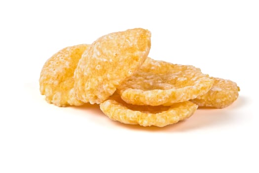 Crunchy, sweet corn flakes on a white background