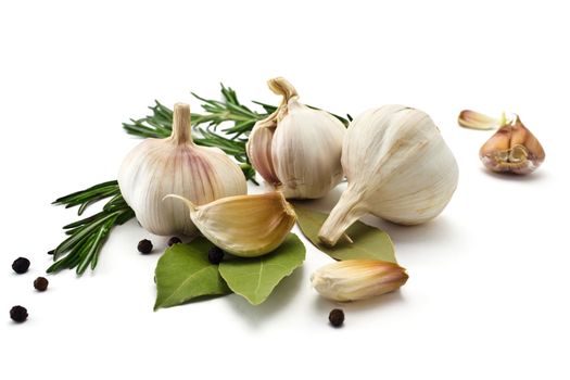 Garlic and rosemary and bay leaf isolated on white background 
garlic, rosemary and bay leaf 
slice garlic