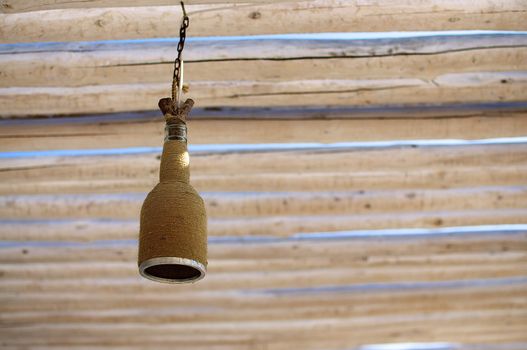 Ceiling lights in one of the beach cafes in Varna is made ​​of old bottles wrapped with hemp cord