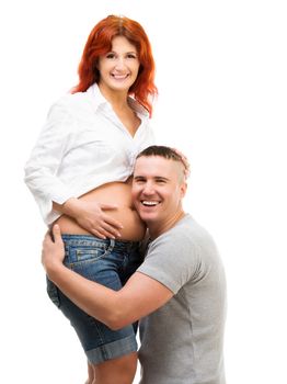 Husband hugs his pregnant wife isolated on white background