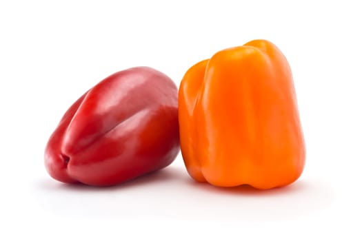 Two juicy peppers on a white background