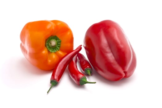 sweet and spicy peppers isolated on white background