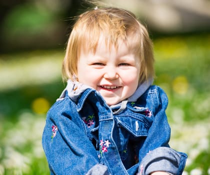 Smiling baby in field of flowers