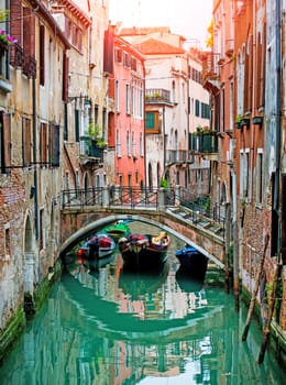 Beautiful Venetian water canal with bridges and gondolas