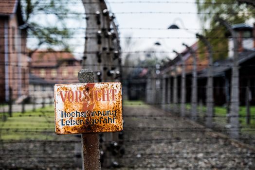 Warning sign in the former concentration and extermination camp Auschwitz-Birkenau, Poland