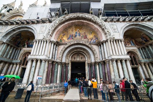 VENICE, ITALY/EUROPE - APRIL 21 : View of Basilica di San Marco a Venezia from St Mark's square in Venice on April 21, 2014. Unidentified people.