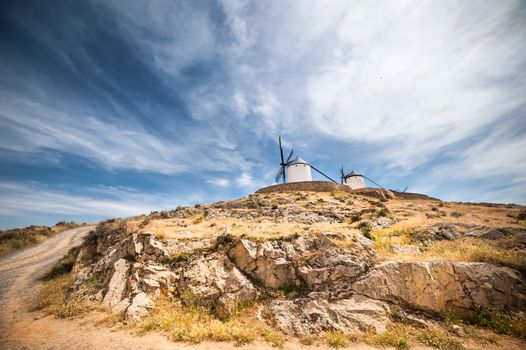 traditional windmills and castle in Consuegra, Toledo, Spain