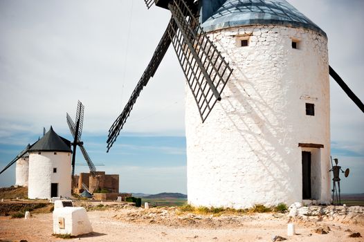 traditional windmills and castle in Consuegra, Toledo, Spain