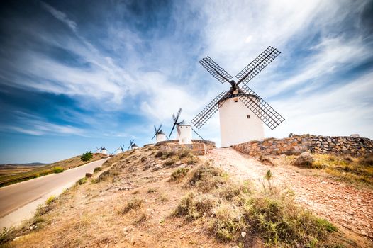 traditional windmills and castle in Consuegra, Toledo, Spain