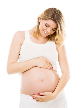 Smiling pregnant woman huggin her belly on a white background