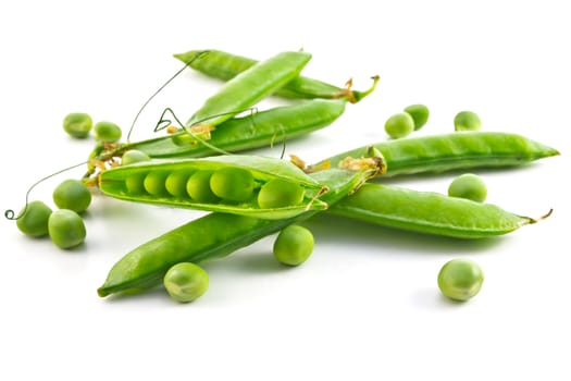 pods of green peas and some peas on a white background