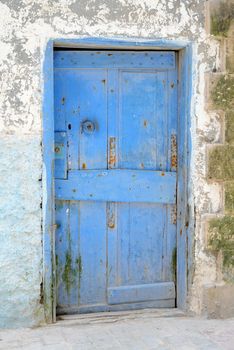 Blue weathered door in Marrakech, Morocco