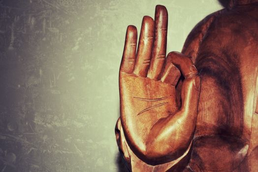 Hand of a beatyfull wooden Buddha statue