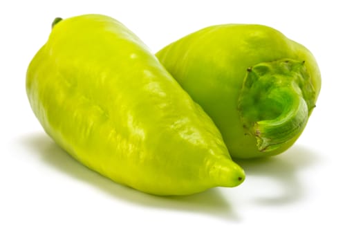 green sweet peppers on a white background